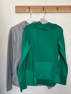 Pair of Athleta pullovers, grey and kelly green